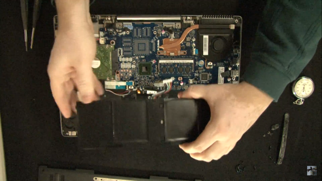 Unscrew the battery bolts and detach the battery wire from the motherboard.